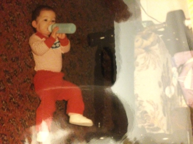 Holding my bottle on my own.  Becoming independent to soothe myself