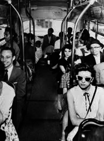 whitesa are sitting in the front and blacks sitting in the back