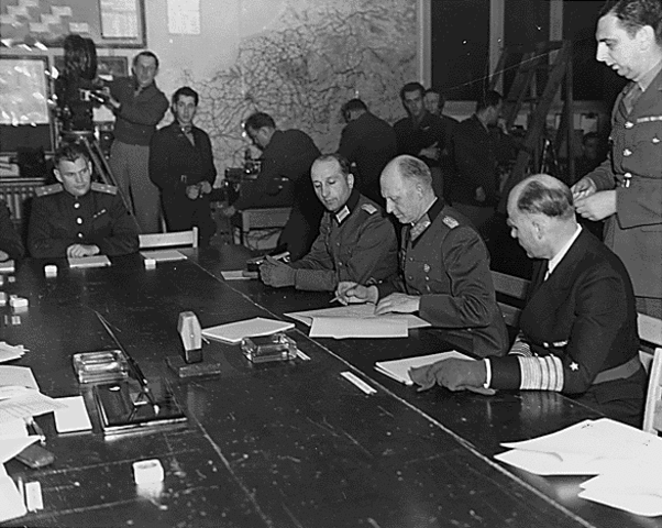 General Eisenhower accepts the unconditional surrender of the 3rd Reich from the German military