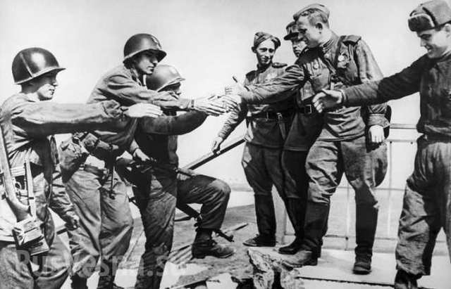 Americna forces meet up with their Russian allies at the Elbe River in Germany