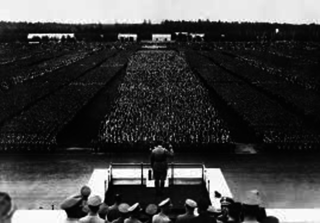 Hitler violates treaty of versalles by introducing military conscription