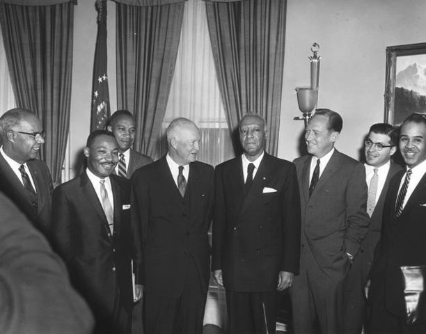 Dwight David Eisenhower signs the first Civil Rights Bill of 1957.