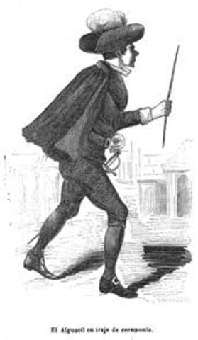 A los alguaciles se les entregaba la vara de justicia  por cedula real.