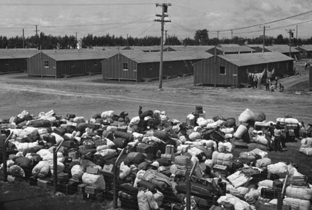 U.S. President Franklin D. Roosevelt signs Executive Order 9066. Its neutral tone authorizes the War Department to designate