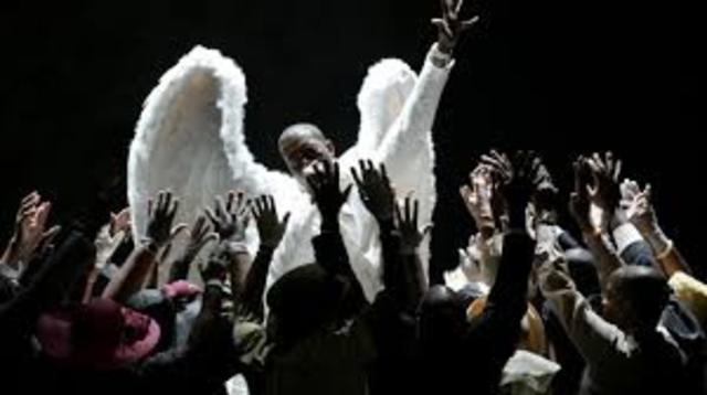 Kanye wins big at first Grammys; performs Jesus Walks & makes epic acceptance speech.