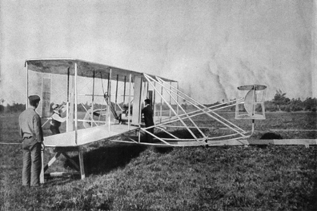 Orville Wright makes the first powered airplane flight.