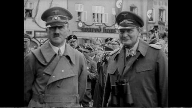 Adolf Hitler receives an intelligence report on Czechoslovakian weapons and defensive installations