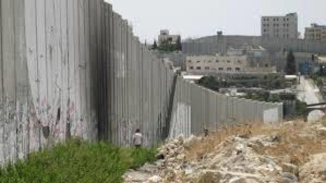 Israel begins constructing the West Bank Barrier
