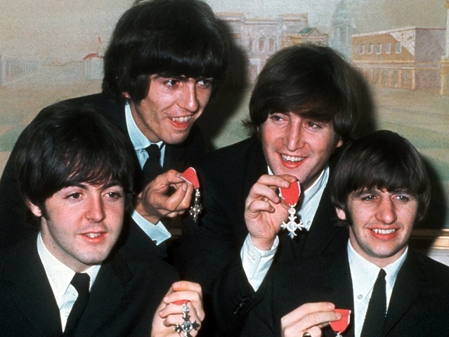 All members of The Beatles receive MBE awards.