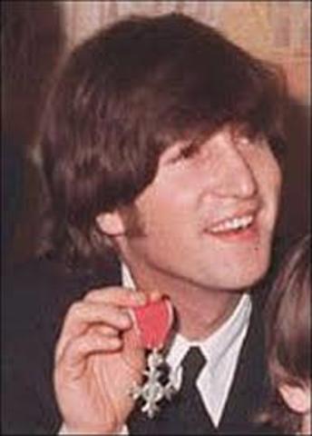 John returns MBE award.