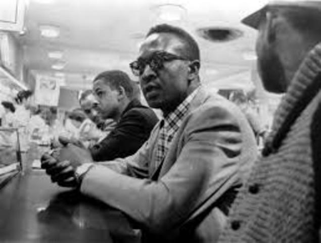 Black Students stage sit-in at "whites only" lunch counter.