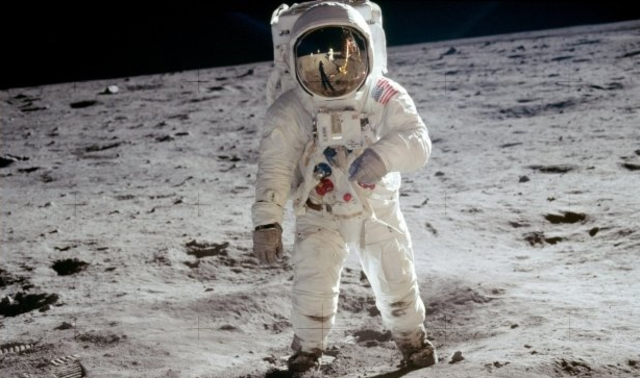 Neil Armstrong puts man on the moon