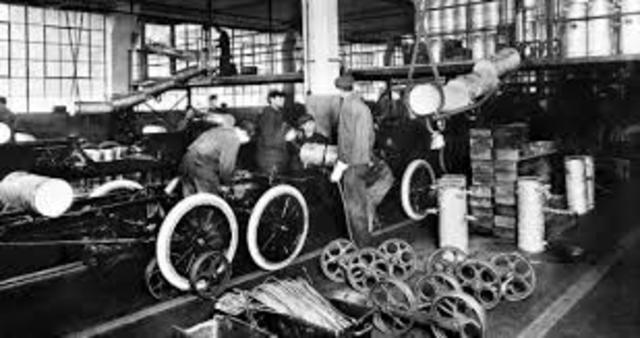 Ford Motor Company introduces moving assembly line