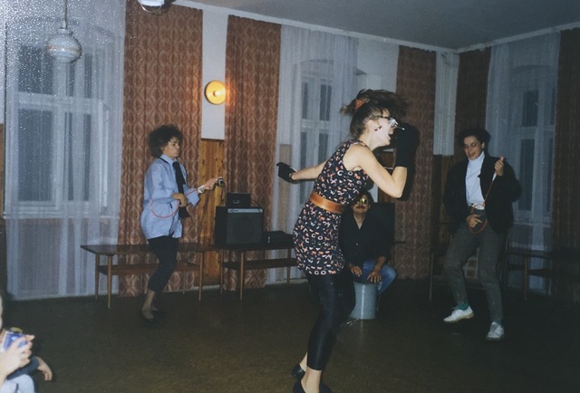 The teachers perform for the students.