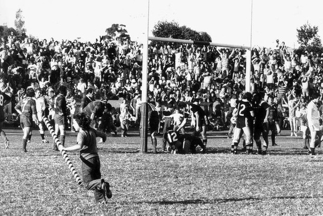Charlie and Normans parents go watch Norman play a footy match