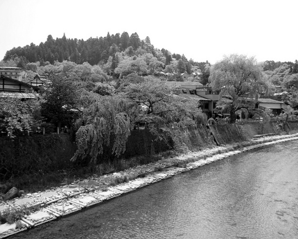 Two charter buses push into the Hida River on National Highway Route 41 in Japan, in an accident caused by heavy rain; 104 are killed.