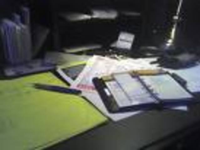 Trent watching a bug crawl across his desk.