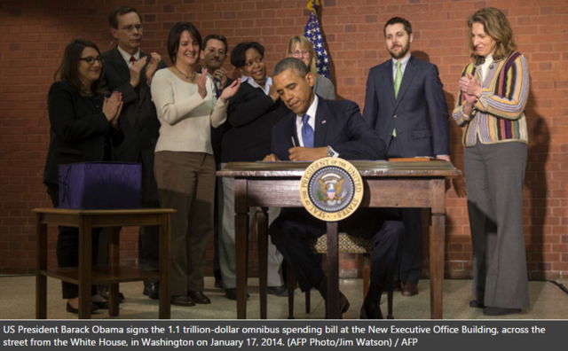 Safe from shutdown: Obama signs trillion-dollar budget