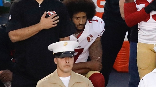 Colin Kaepernick takes a knee during National Anthem