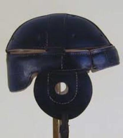 The first football helmet was worn