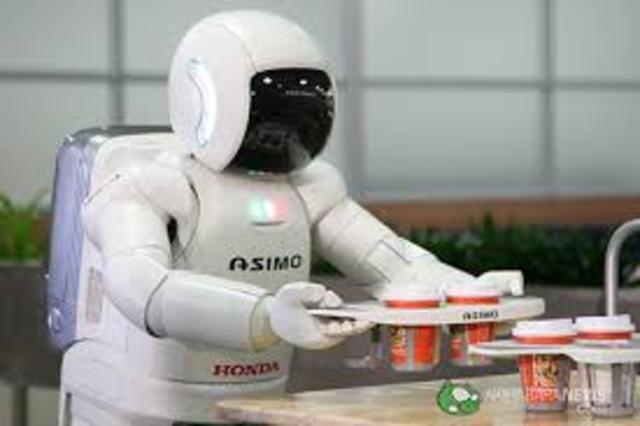 "ASIMO" carrying a tray of coffee.