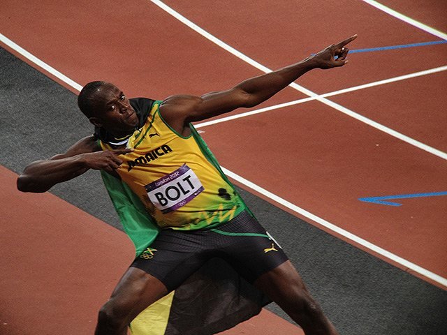 Usain Bolt successfully defends his 100m Olympic title