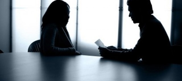 A detective and policeman question Lara