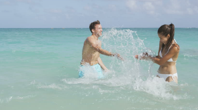 The first time Marie and Meursault go to the beach.