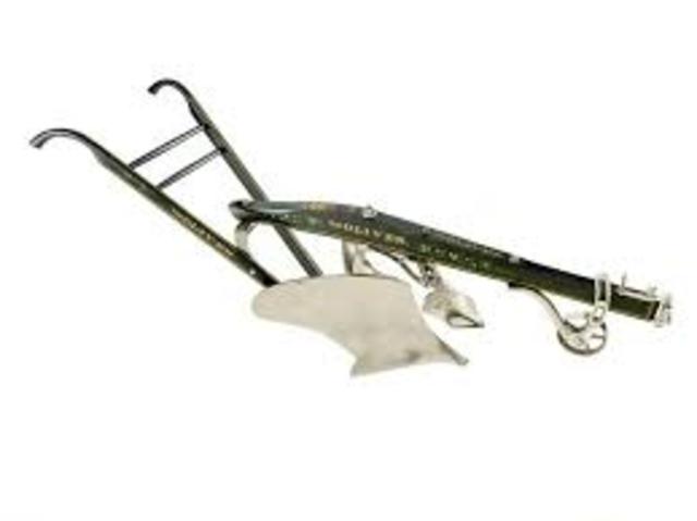 The invention of the removable tempered steel plow blade