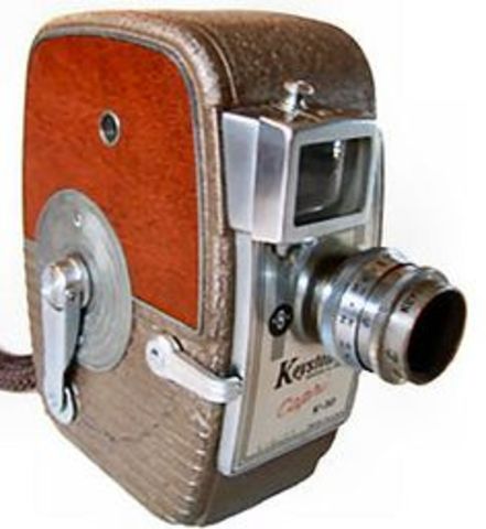 Motorized movie cameras invented, replaced hand cranked cameras
