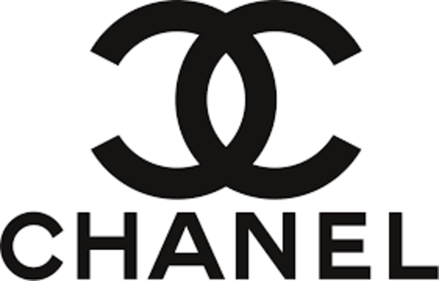 Coco Chanel creates her company's logo.