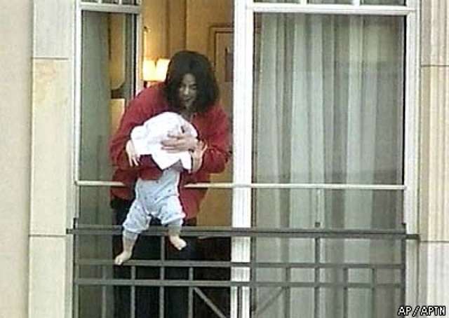 DANGLES HIS NEWBORN SON