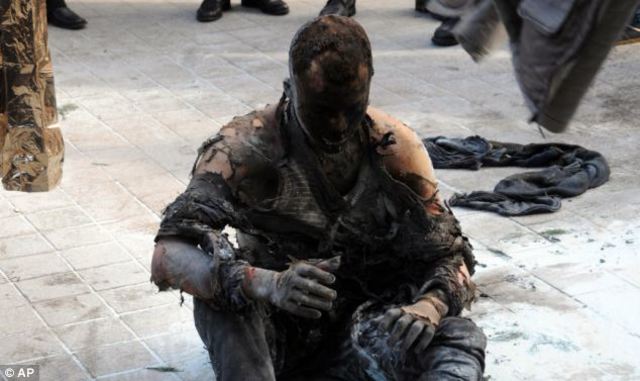 Tunisia ~ Fruit seller lights himself on fire