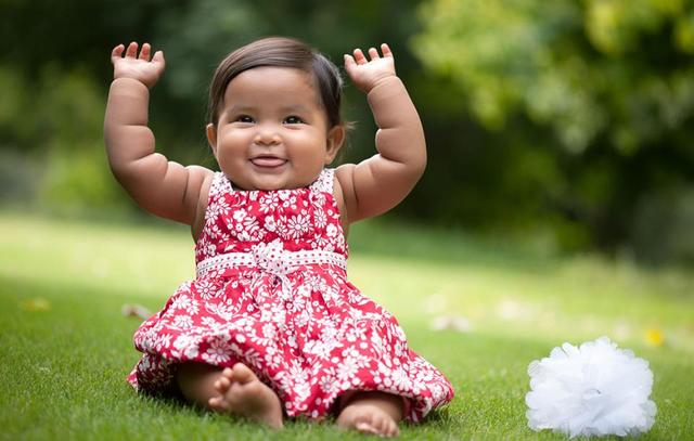 baby sitting upward by itself