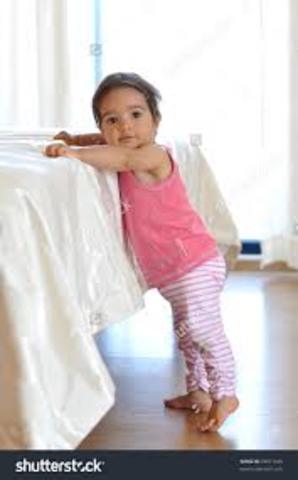 standing (holding something)