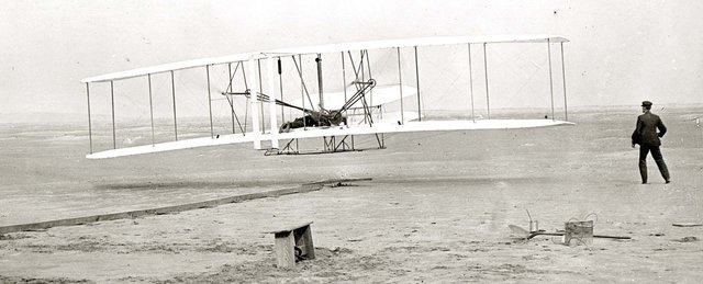 Orville Wright makes the first powered airplane flight