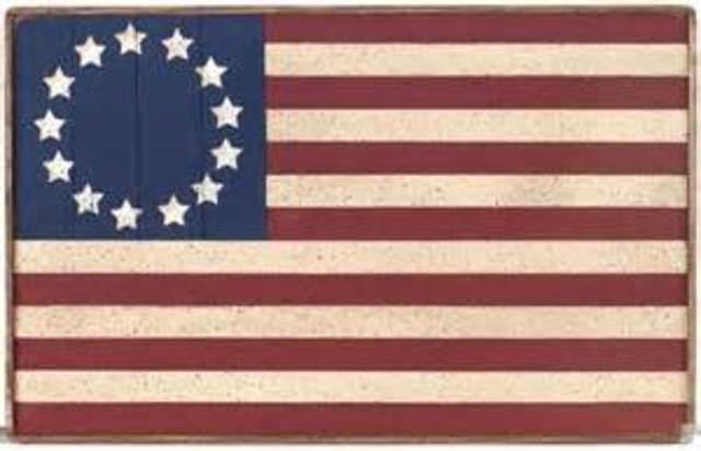 The 13 colonies are represented in the first American flag