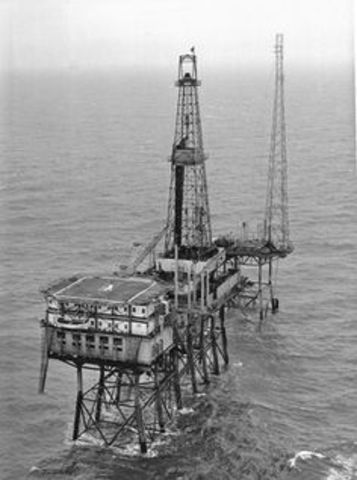 The first offshore oil wells are drilled.