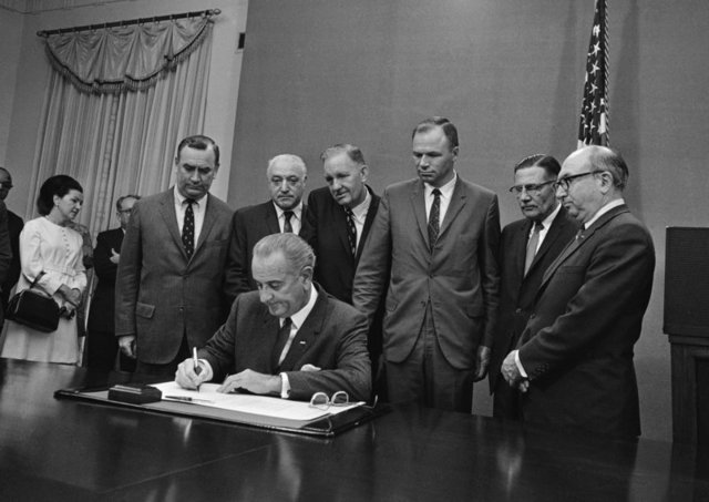 LBJ Signs Jobs Bill
