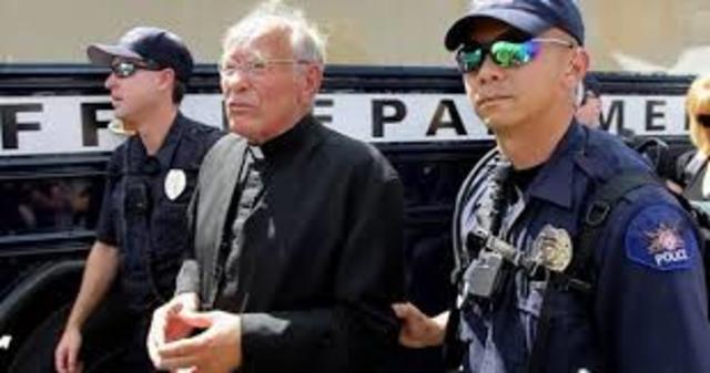 Priest Arrested