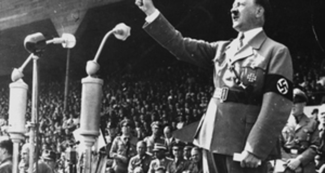 Hitler openly announces to his cabinet he will defy the Treaty of Versailles