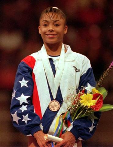 Dominique Dawes Becomes the First African American To Get A Gold Medal In Gymnastics