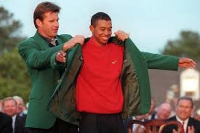 In his first major championship as a professional, Tiger Woods becomes the youngest-ever Masters Champion at 21 years 3 months