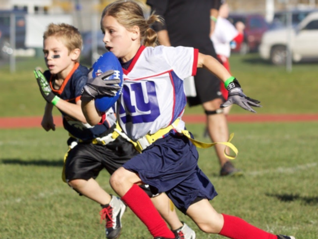 7-year-old girl breaks football throwing record