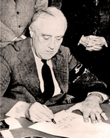 America declares war on Japan and enters WWII