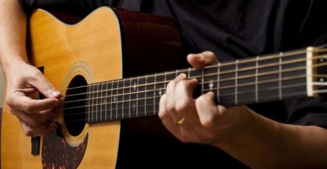 Learns How To Play Guitar