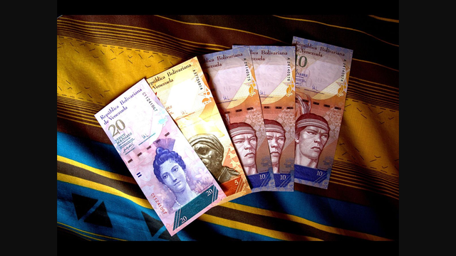 Chavez devalues the bolivar for basic goods
