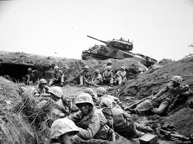 US Marines invade the island of Iwo Jima. After a fierce battle they capture the island.