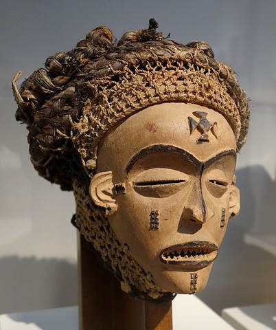 Female (Pwo) mask. Chokwe peoples (Democratic Republic of the Congo). Wood, fiber, pigment, and metal