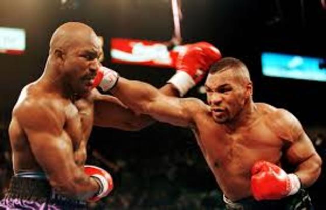 Mike Tyson knocks out Michael Spinks in heavy weight fight